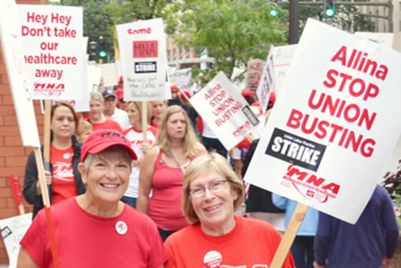Nurses picket outside United Hospital in St. Paul during an open-ended strike that began on Labor Day. Union Advocate photo