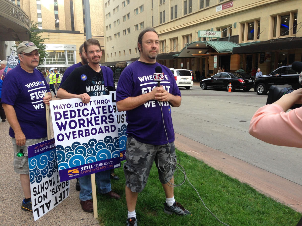 Wes Keck (right) and other food service workers spoke to reporters in September about their plans to seek union representation. Workday Minnesota photo