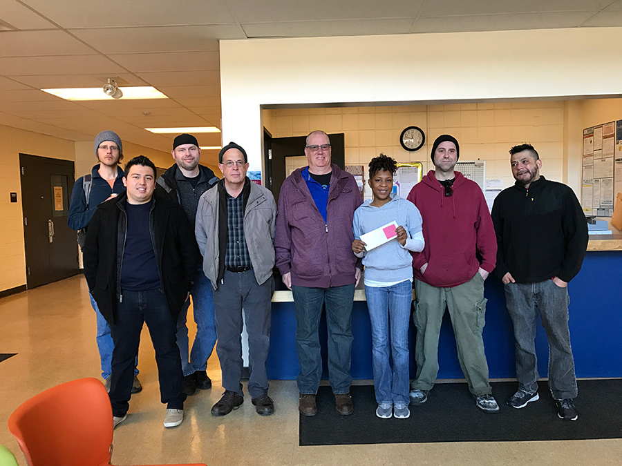 Franklin Street Bakery workers and representatives of the Bakery, Confectionery, Tobacco & Grain Millers Union and the Minnesota AFL-CIO presented a check for more than $1,000 to support the food shelf at Waite House in south Minneapolis.