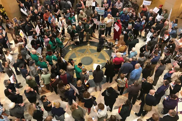 Photo of union members in the Capitol rotunda.